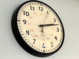 A wall clock showing the time as 2:12