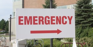 A hospital sign indicating where the emergency department is located