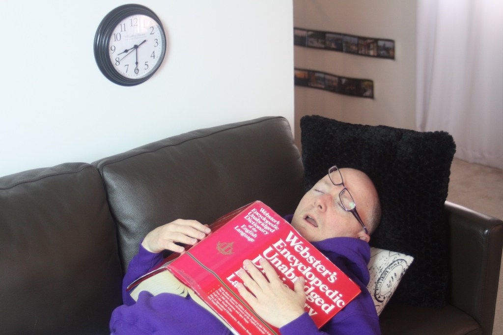 The author, asleep on the couch at 8:30