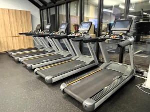 A row of treadmills at a gym.