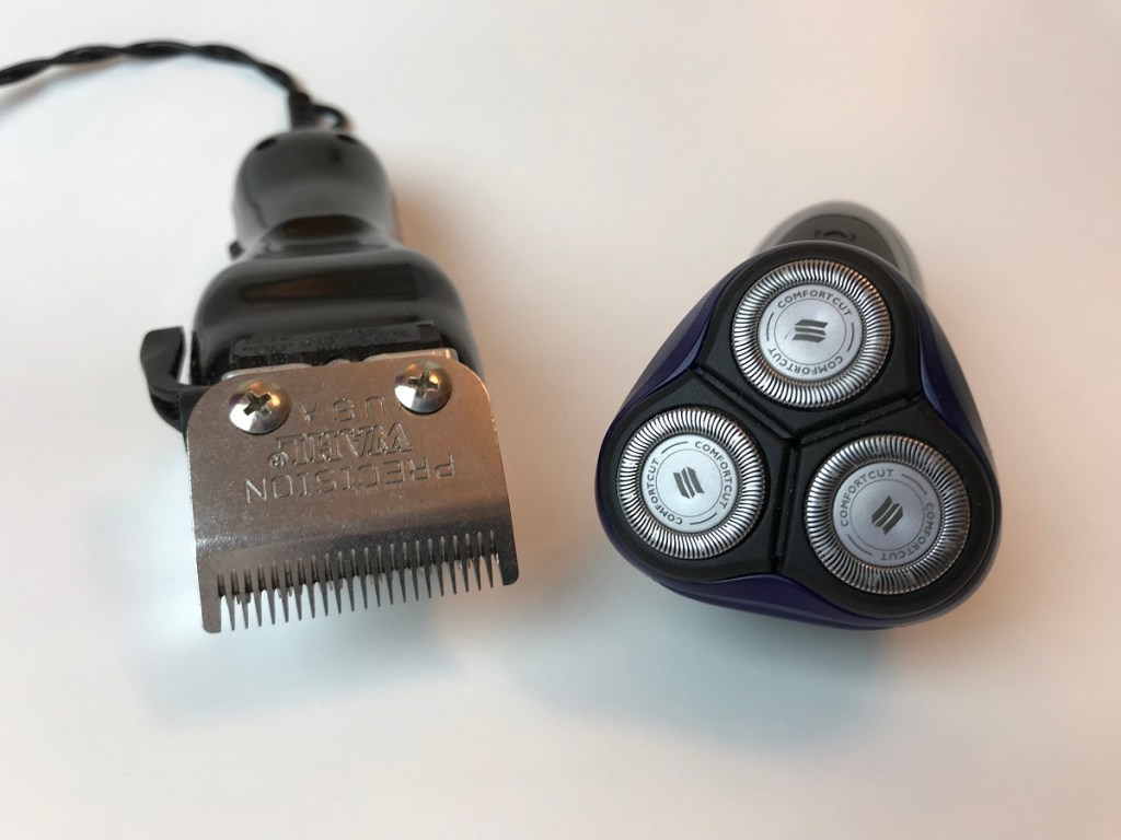A set of hair clippers and a rotary shaver