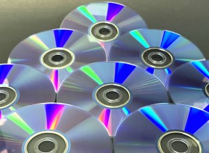 A close-up shot of some CDs with the light shimmering above creating a cool geometric effect.