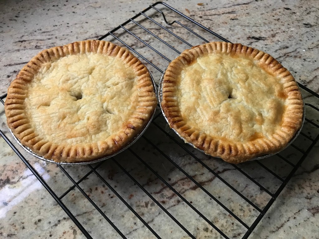 two pot pies on a kitchen counter