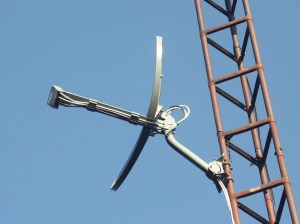 A satellite dish against a blue sky