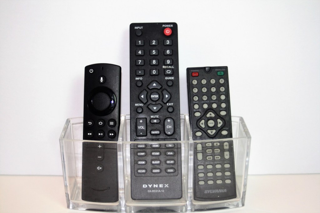 Three remote controls against a white background