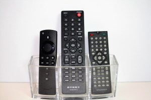 Three remote controls against a white background