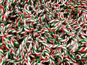 A close-up shot of candy canes in a bulk store's bin.