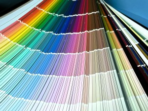 A catalogue of paint chips fanned out to show its brilliant colours.