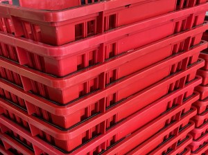 A stack of shopping baskets at the grocery store.
