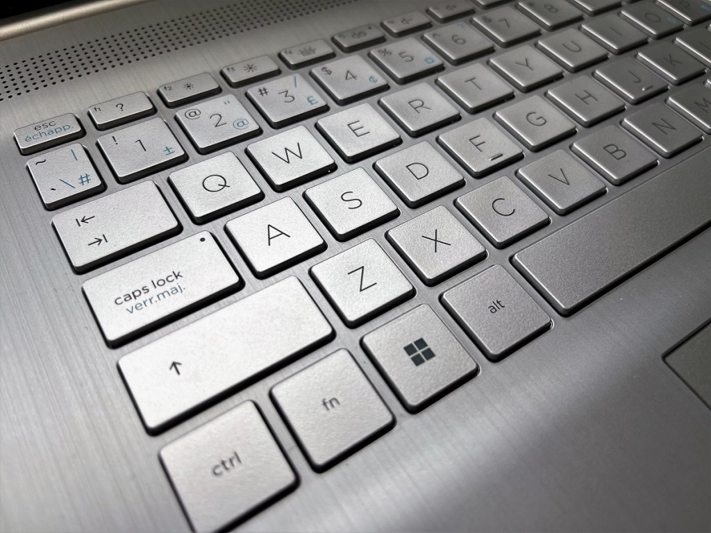 A close-up shot of a silver computer keyboard