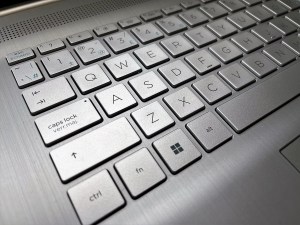 A close-up shot of a silver computer keyboard