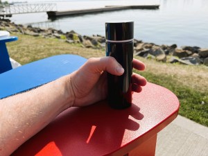 A photo of me enjoying my little bottle of water by the waterfront.